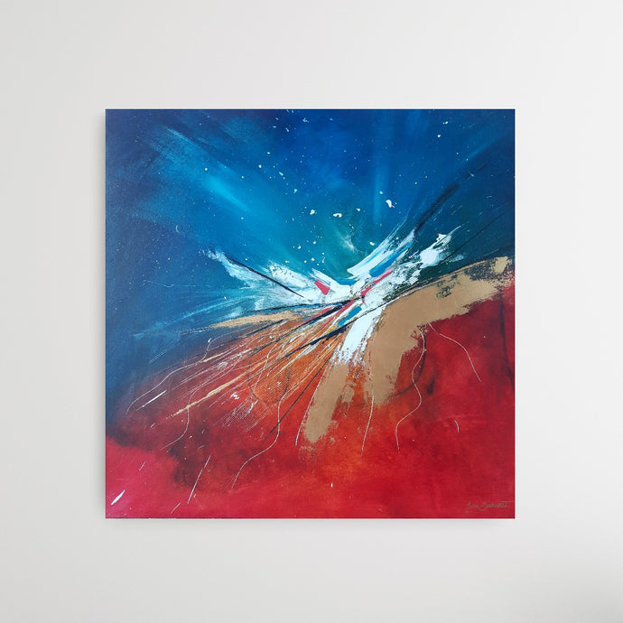 Large abstract painting of a color explosion with blue, gold, red and white 